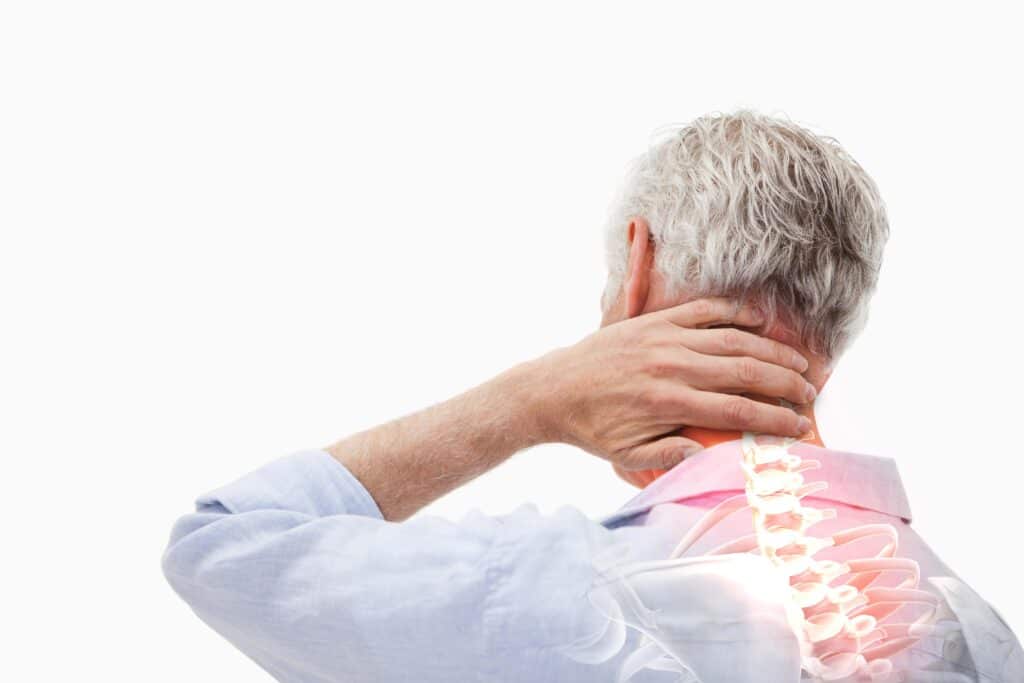 A person holding the back of their neck