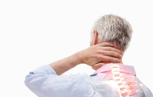 A person holding the back of their neck